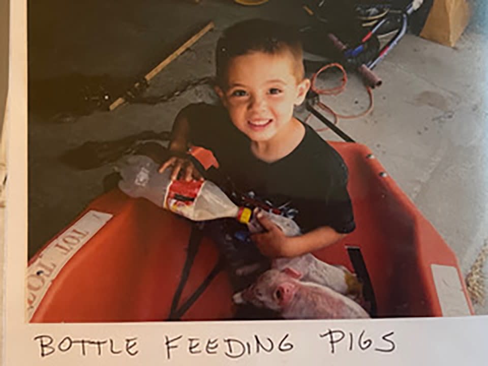 Rounds bottle feeding pigs as a youngster