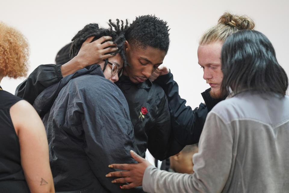 People comfort each other after a vigil for a group of Americans recently kidnapped in Mexico, at Word of God Ministries in Scranton, S.C., Wednesday, March 8, 2023. Two of the four Americans, all from South Carolina, were killed after being caught in a deadly shootout while traveling last week to Matamoros for one of them to get cosmetic surgery. (AP Photo/Sean Rayford)