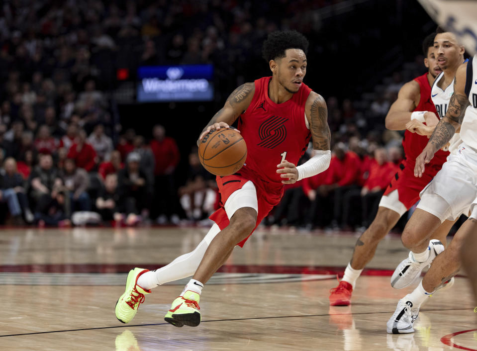 Portland Trail Blazers guard Anfernee Simons drives against the Dallas Mavericks during the second half of an NBA basketball game Friday, Dec. 8, 2023, in Portland, Ore. (AP Photo/Howard Lao)