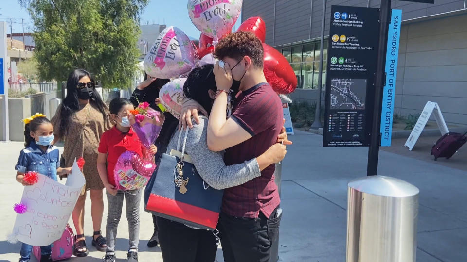 Brian hugs his mother, Sandra, after being reunited in California (NBC News)