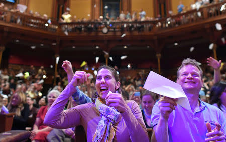 Sally Buta, left, and Mike Scott, both of Arlington, Mass., throw paper airplanes during the 27th First Annual Ig Nobel Prize Ceremony at Harvard University in Cambridge, Massachusetts, U.S. September 14, 2017. REUTERS/Gretchen Ertl