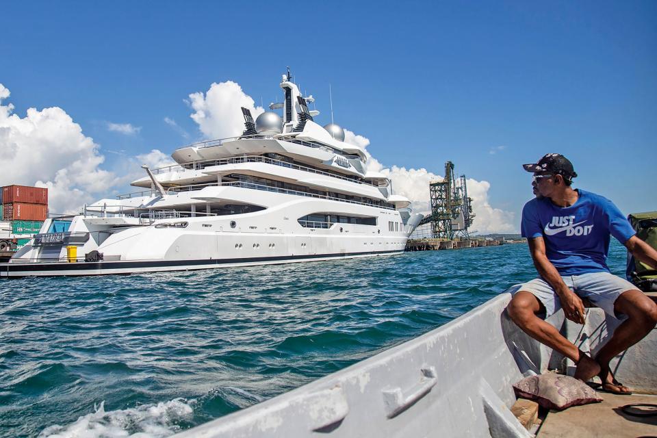 Boat captain Emosi Dawai looks at the superyacht Amadea where it was docked at the Queens Wharf in Lautoka, Fiji, on April 13, 2022.