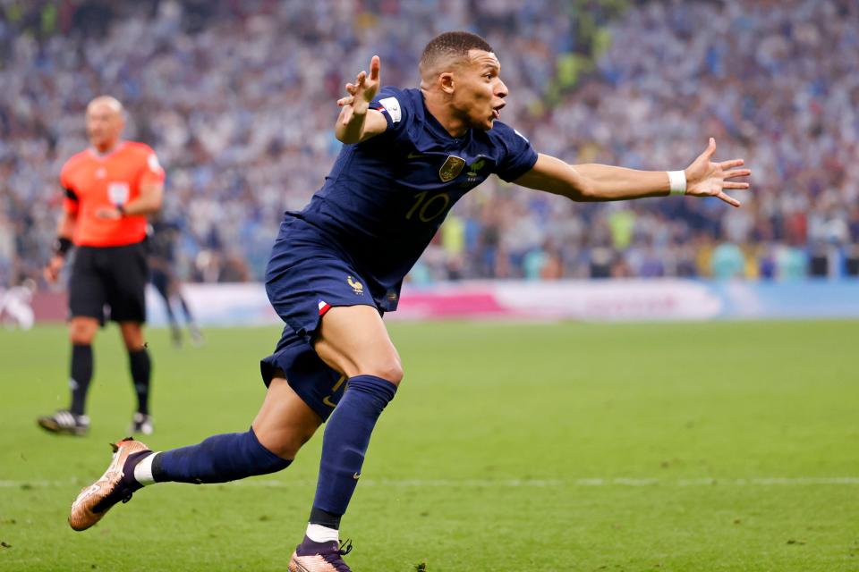 France forward Kylian Mbappe (10) celebrates after scoring his second goal of the match against Argentina during the second half of the 2022 World Cup final at Lusail Stadium.