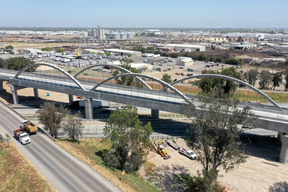 Cables slung from arches support the deck of the 3,700-foot-long Cedar Viaduct for California’s high-speed rail project spans Highway 99 at the south end of Fresno. The viaduct will carry high-speed trains on elevated tracks up and over traffic on the freeway and Cedar and North avenues. Completion of the structure was announced on May 10, 2023.