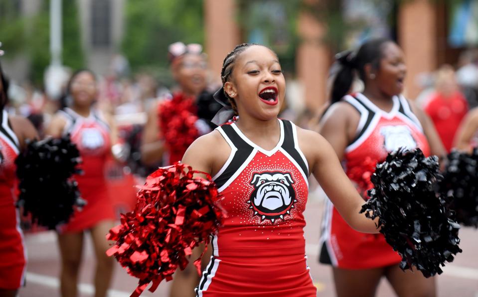 Bulldog cheerleaders lead the way during the 2022 Pro Football Hall of Fame Enshrinement Festival Canton Repository Grand Parade.