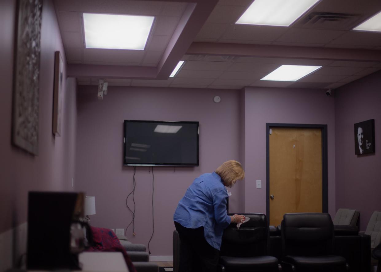 <span>Sonja Miller, managing director of Whole Woman’s Health, cleans the waiting area before the opening of the new clinic in Petersburg, Virginia, on 21 August 2024.</span><span>Photograph: Hadley Chittum/The Guardian</span>