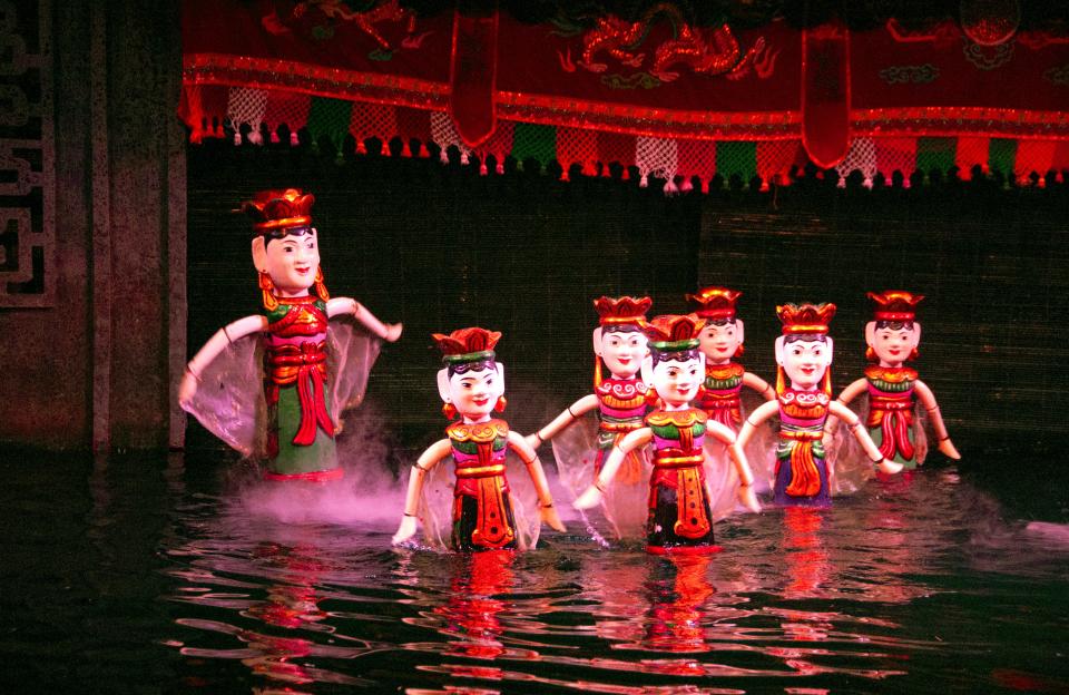 Puppets dancing on the water at the Thang Long Water Puppet Theatre. (Photo: Getty)