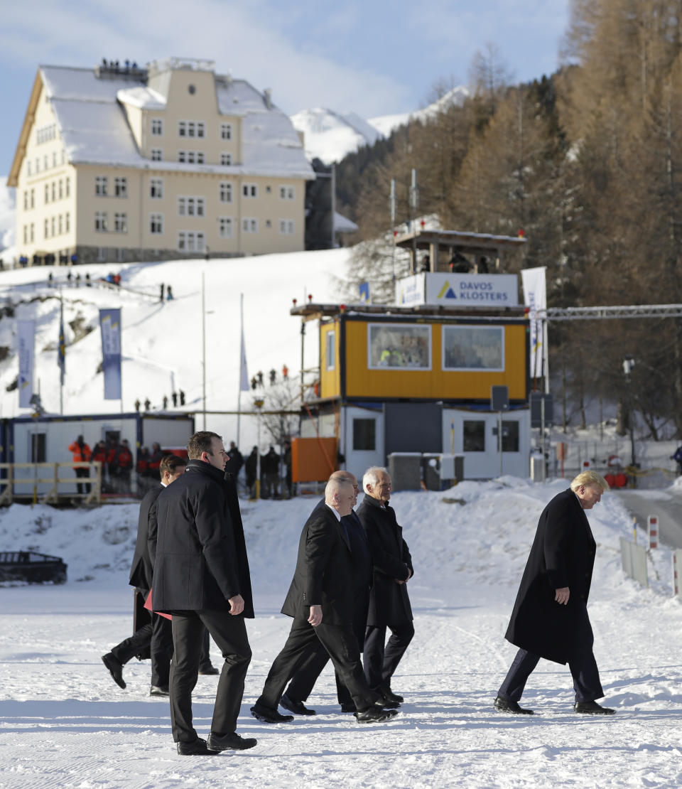 US President Donald Trump, right, arrives in Davos, Switzerland on Marine One, Tuesday, Jan. 21, 2020. President Trump arrived in Switzerland on Tuesday to start a two-day visit to the World Economic Forum. (AP Photo/Evan Vucci)