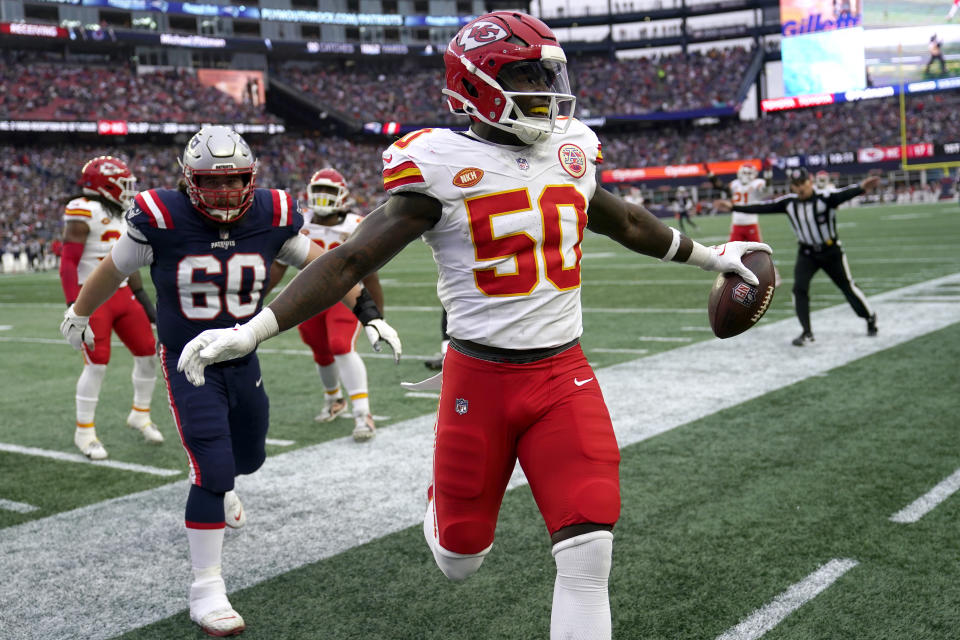 Kansas City Chiefs linebacker Willie Gay (50) celebrates in front of New England Patriots center David Andrews (60) after intercepting a pass thrown by quarterback Bailey Zappe, not shown, during the second half of an NFL football game, Sunday, Dec. 17, 2023, in Foxborough, Mass. (AP Photo/Charles Krupa)