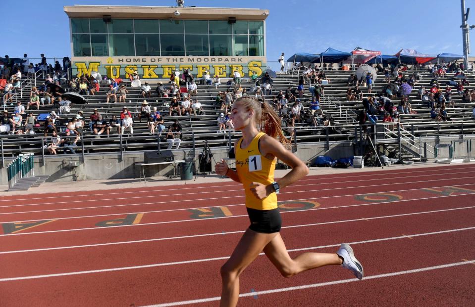 Sam McDonnell of Newbury Park leads the pack in the Division 1 girls 3,200-meter run during the CIF-Southern Section Track and Field Championships at Moorpark High on Saturday, May 14, 2022. She won the title with a time of 10:28.91.