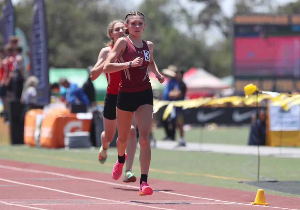 Oaks Christian's Payton Godsey leads the way in the Division 4 girls 1,600-meter race during the CIF-Southern Section Track and Field Championships at Moorpark High on Saturday, May 13, 2023. Godsey won the title in 4:55.56.