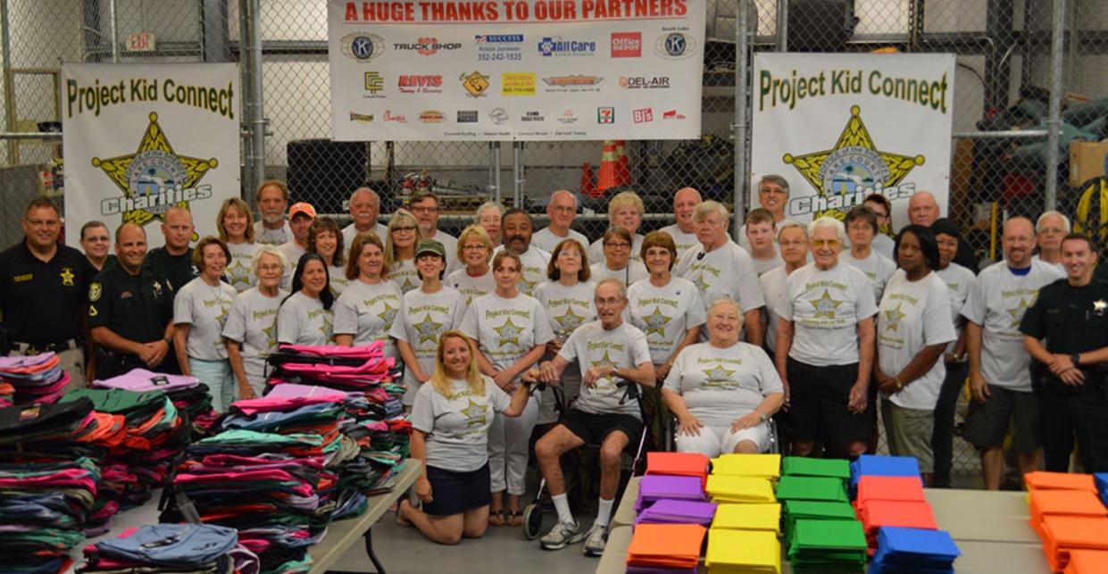 Community volunteers gather at a past Project Kid Connect back-to-school event to disburse free school supplies. Their next event will be Saturday, July 13.