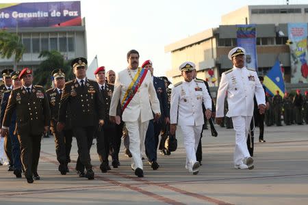 Venezuela's President Nicolas Maduro (C) attends a ceremony to mark the birthday of the South American independence leader Simon Bolivar in La Guaira, Venezuela July 24, 2017. Miraflores Palace/Handout via REUTERS