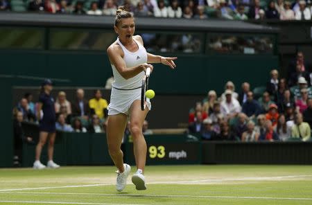 Britain Tennis - Wimbledon - All England Lawn Tennis & Croquet Club, Wimbledon, England - 5/7/16 Romania's Simona Halep in action against Germany's Angelique Kerber REUTERS/Stefan Wermuth