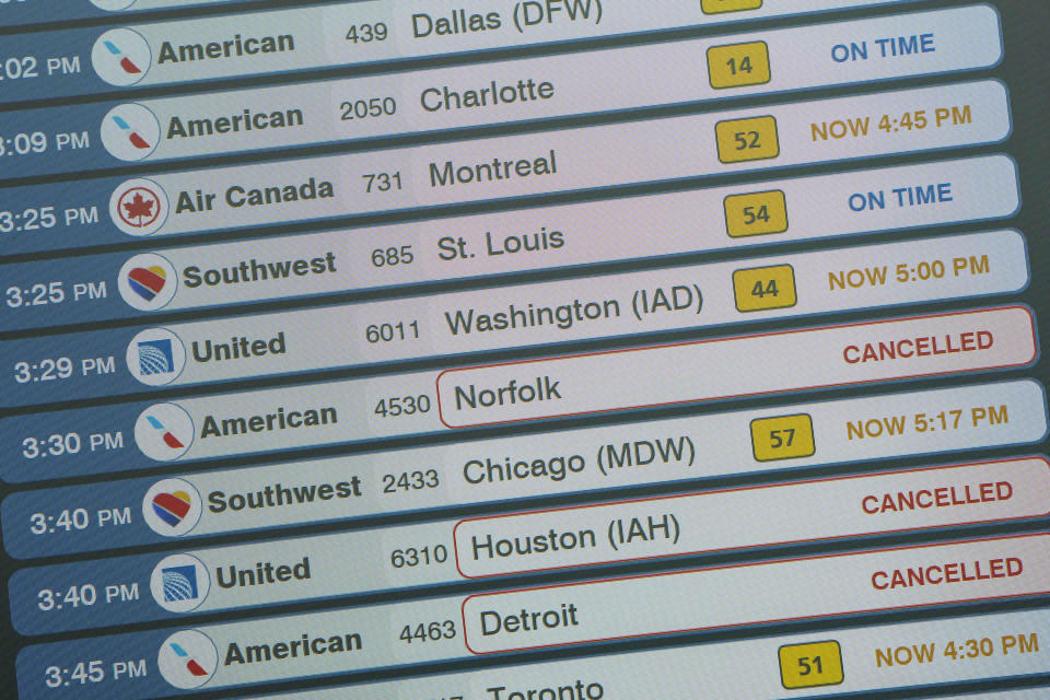 A monitor displays in the departures area of Terminal B at LaGuardia Airport displays flight statuses, Tuesday, June 27, 2023, in New York. Travelers waited out widespread delays at U.S. airports on Tuesday, an ominous sign heading into the long July 4 holiday weekend, which is shaping up as the biggest test yet for airlines that are struggling to keep up with surging numbers of passengers. (AP Photo/Mary Altaffer)