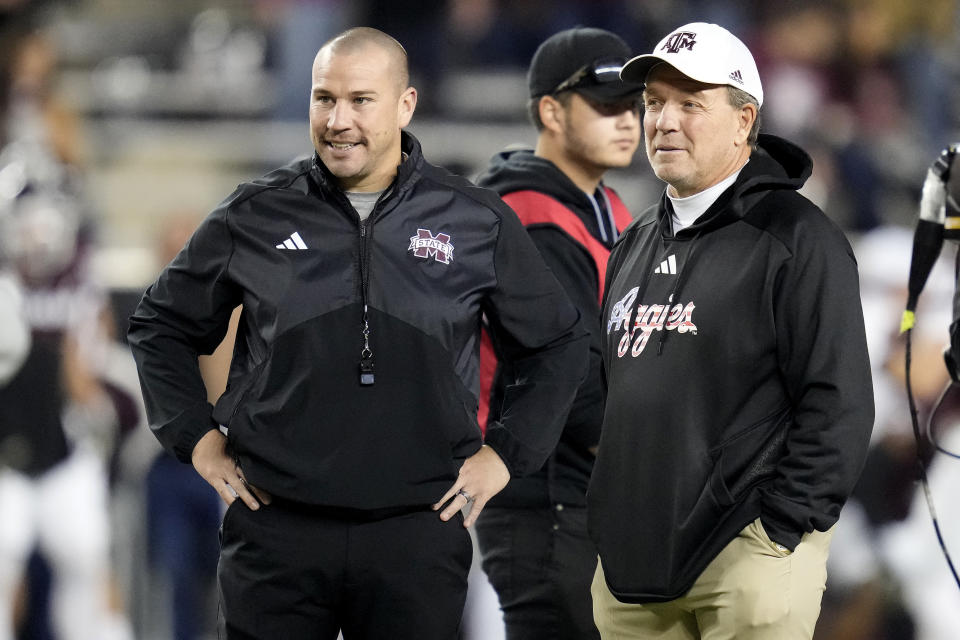 Texas A&M head coach Jimbo Fisher, right, talks with Mississippi State head coach Zach Arnett, left, before the start of an NCAA college football game Saturday, Nov. 11, 2023, in College Station, Texas. Mississippi State fired coach Zach Arnett on Monday, Nov. 13, 2023, just 10 games into his first season on the job as the late Mike Leach's replacement. (AP Photo/Sam Craft)