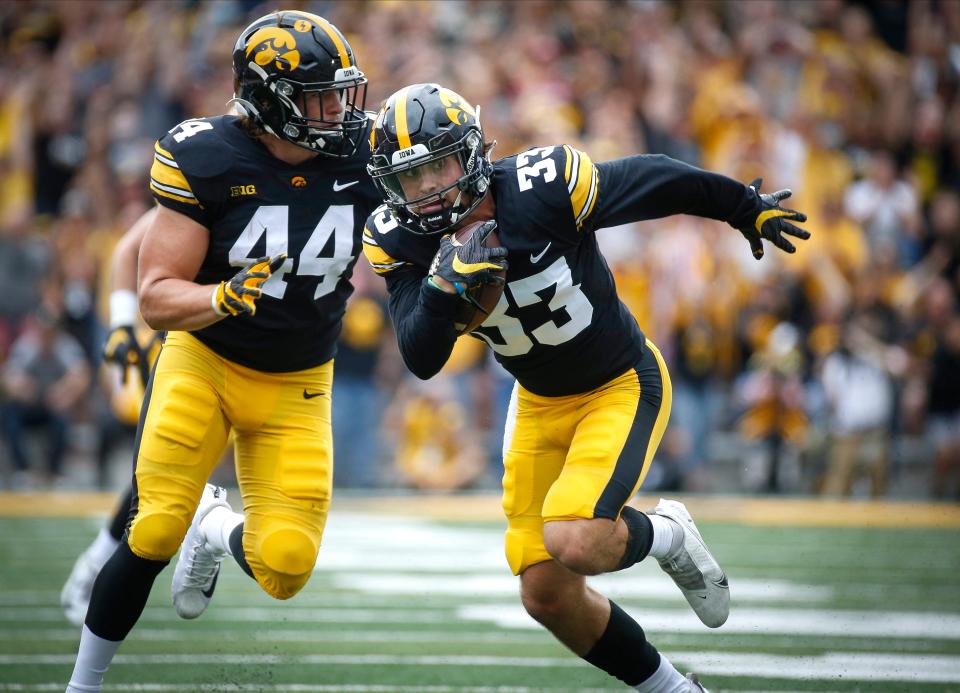 Iowa senior defensive back Riley Moss intercepts a pass in the first quarter against Indiana at Kinnick Stadium in Iowa City on Saturday, Sept. 4, 2021. Moss took the interception to the end zone for the Iowa Hawkeyes second touchdown of the first quarter.