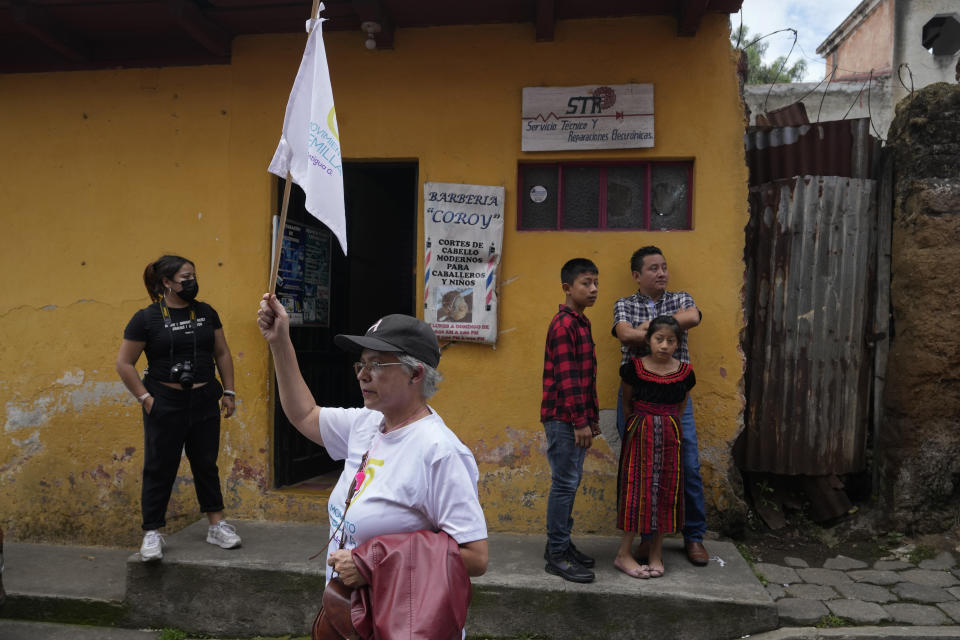 A supporter of the Seed Movement party waits for the arrival of presidential candidate Bernardo Arevalo, at a campaign rally in Santa Maria de Jesus, Guatemala, Sunday, July 16, 2023. Arevalo, 64-year-old academic and former diplomat, will face former first lady Sandra Torres in a presidential runoff on Aug. 20th. (AP Photo/Moises Castillo)