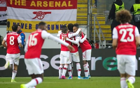 Arsenal players celebrate a goal in Germany - Arsenal youth lift gloom with Europa League victory at Eintracht Frankfurt - Credit: REX FEATURES