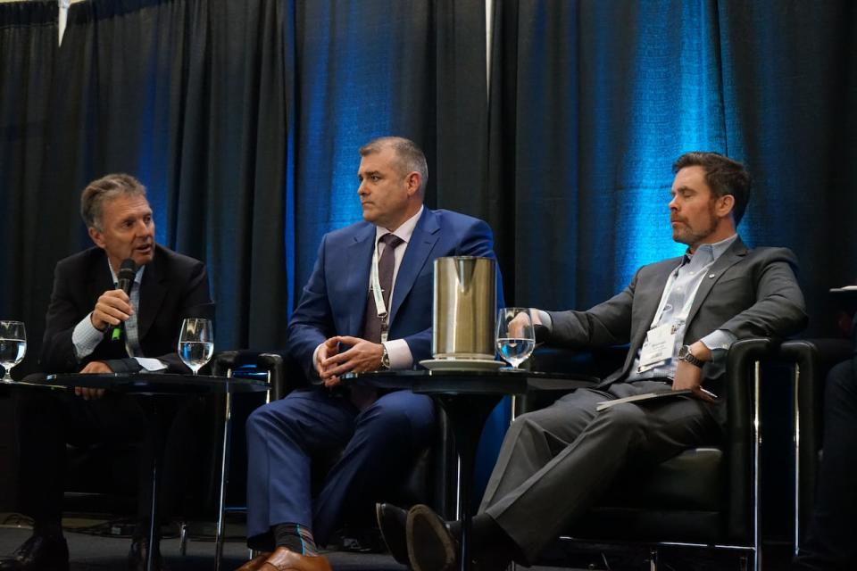 Alistair Corbett (left) speaking with Wyloo Canada CEO Kristan Straub (middle) on a panel during the 2024 PDAC convention.