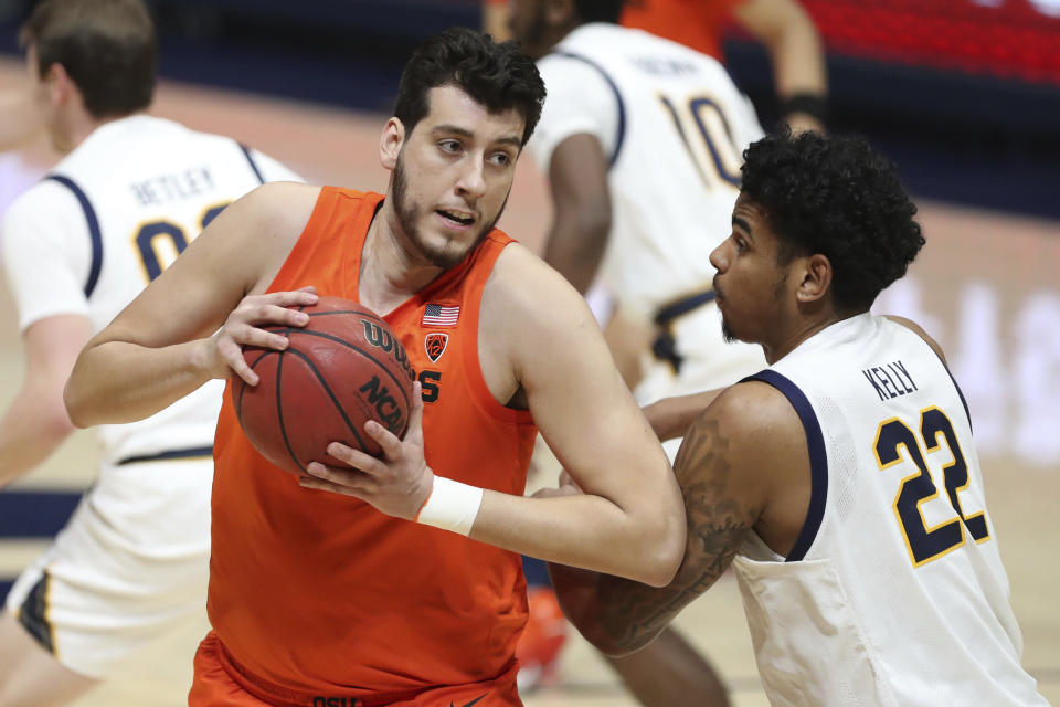 Oregon State center Roman Silva drives to the basket against California forward Andre Kelly during the first half of an NCAA college basketball game in Berkeley, Calif., Thursday, Feb. 25, 2021. (AP Photo/Jed Jacobsohn)