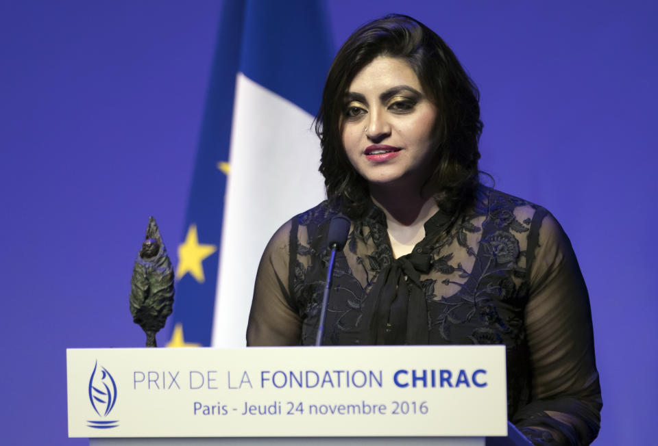 FILE - In this Nov. 24 2016 file photo, Pakistan's Gulalai Ismail delivers an acceptance speech after being awarded the Prize for Conflict Prevention for the work of her organization 'Aware Girls' promoting women's issues and equality in Pakistan, during the award ceremony of the Jacques Chirac Foundation at the Musee Branly, in Paris, France. On Thursday, Oct. 17, 2019, a dozen plainclothes Pakistani security forces attempted to raid the former home of Ismail, a human rights activist who recently fled to the United States seeking asylum. Ismail's elderly parents say they were ordered to come outside "just to talk," but refused. (Ian Langsdon, Pool via AP, File)