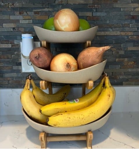 Reviewer's photo of fruit basket on a white counter.