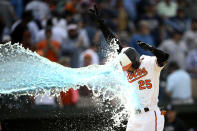 Baltimore Orioles' Anthony Santander is doused as he celebrates as he heads home after hitting a three-run walk off home run during the ninth inning of a baseball game against the New York Yankees, Thursday, May 19, 2022, in Baltimore. The Orioles won 9-6. (AP Photo/Nick Wass)