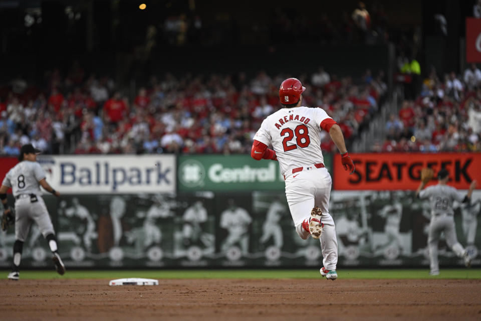 St. Louis Cardinals' Nolan Arenado (28) run the bases after hitting a two-run double against the Chicago White Sox during the first inning of a baseball game Friday, May 3, 2024, in St. Louis. (AP Photo/Jeff Le)