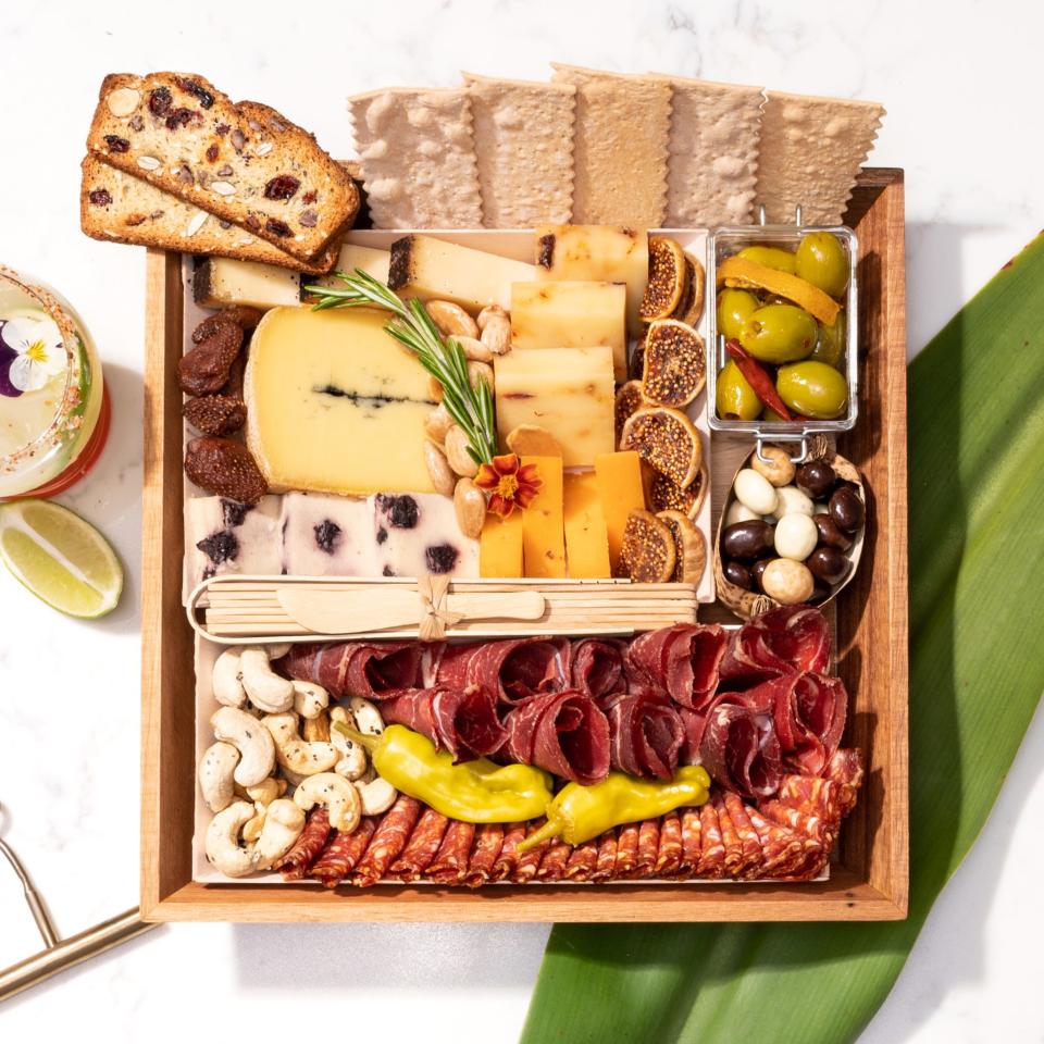 Boarderie's Ciccetti cheese and charcuterie board is shipped as ready-to-serve in an acacia wood tray.