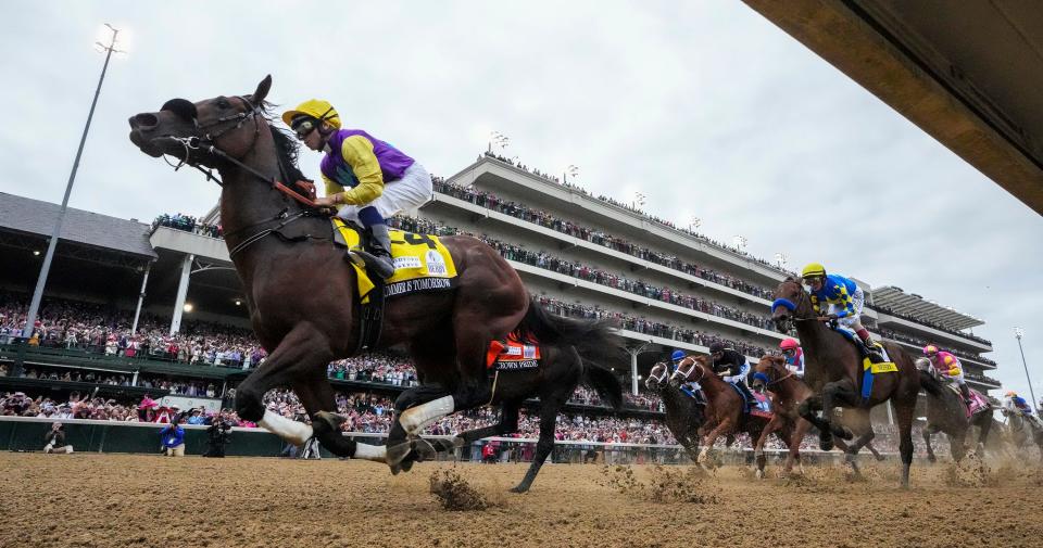 The field passes the grandstand in Kentucky Derby 148 on Saturday, May 7, 2021
