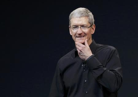 Apple Inc CEO Tim Cook speaks on stage during an Apple event in San Francisco, California October 22, 2013. REUTERS/Robert Galbraith