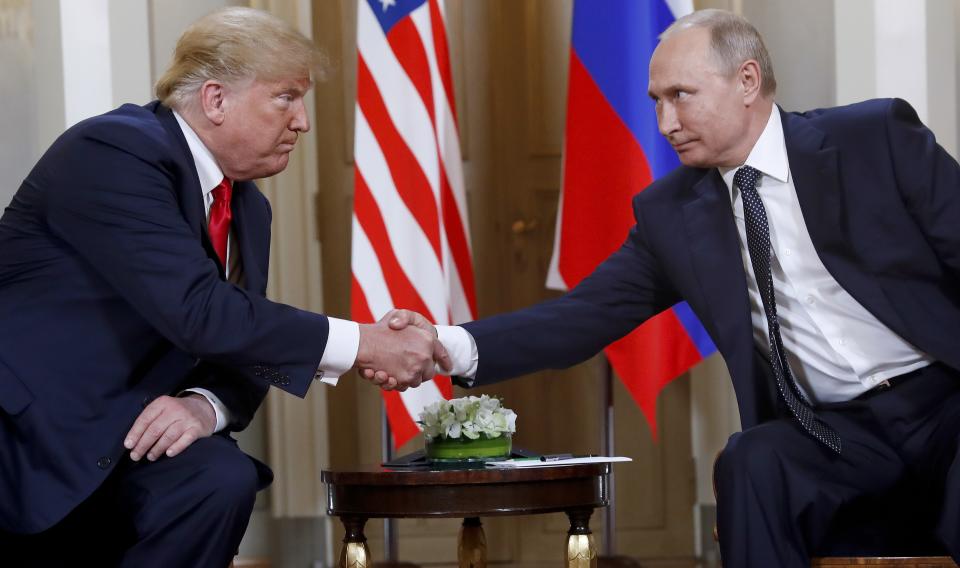 FILE In this file photo taken on Monday, July 16, 2018, U.S. President Donald Trump, left, and Russian President Vladimir Putin shake hands at the beginning of a meeting at the Presidential Palace in Helsinki, Finland. U.S. special counsel Robert Mueller has yet to release his report about Russian meddling in the 2016 U.S. presidential election, but Moscow has already rehearsed its response, dismissing Mueller's investigation as part of the U.S. political infighting. (AP Photo/Pablo Martinez Monsivais, File)