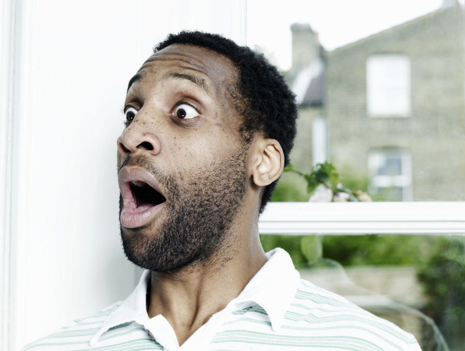 A man with his mouth open in surprise