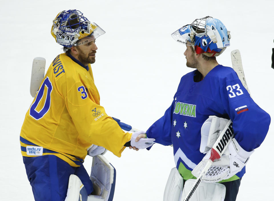 Sweden goaltender Henrik Lundqvist greets Slovenia goaltender Robert Kristan after Sweden beat Slovenia 5-0 in a men's quarterfinal ice hockey game at the 2014 Winter Olympics, Wednesday, Feb. 19, 2014, in Sochi, Russia. (AP Photo/Mark Humphrey)