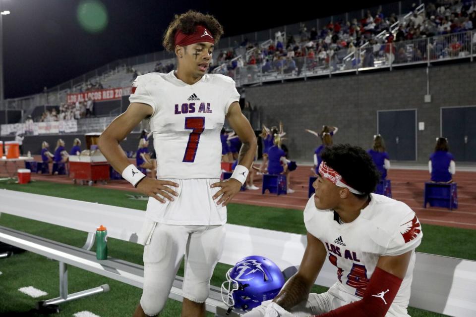 Los Alamitos quarterback Malachi Nelson with Makai Lemon during a game against Santa Margarita.