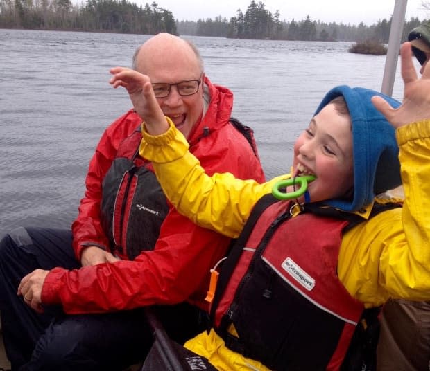 Dr. Robert Strang, Nova Scotia's chief medical officer of health, with his son, now 15. Despite the fact his son has severe physical and intellectual disabilities, Strang says he's confident in the province's age-based approach to determining the order for vaccinating the public. 