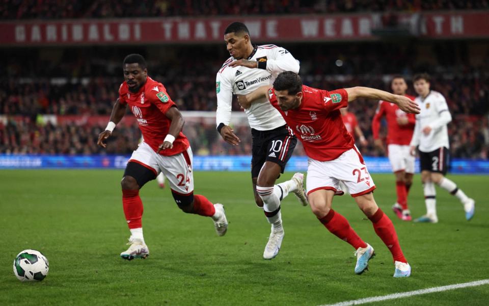 Manchester United's English striker Marcus Rashford (C) fights for the ball with Nottingham Forest's Swiss midfielder Remo Marco Freuler - AFP/Darren Staples