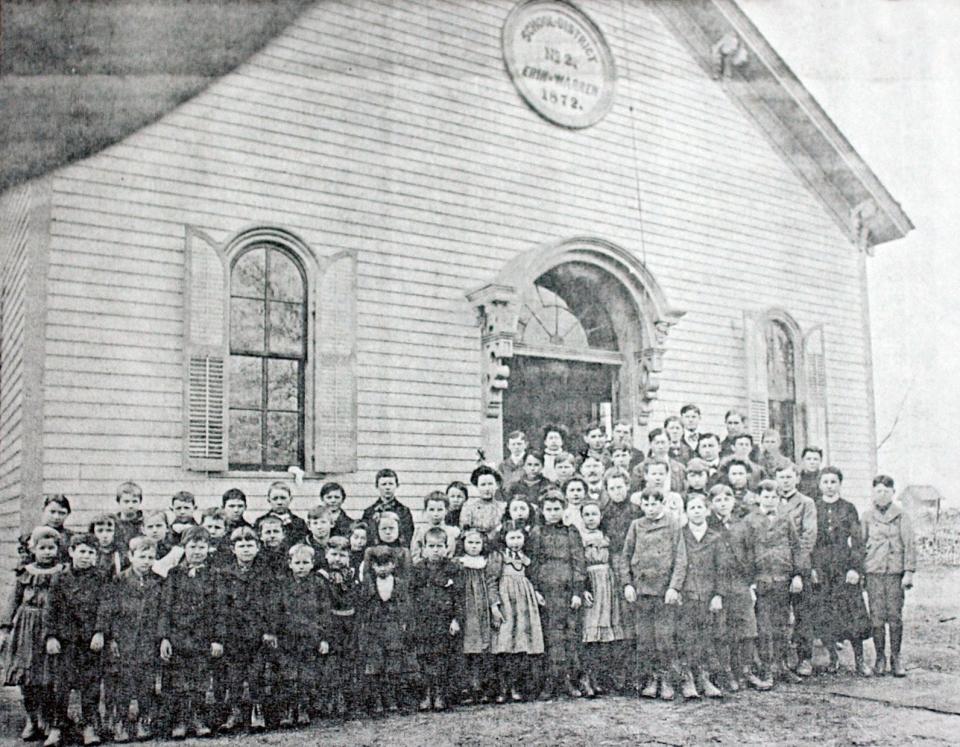 An 1895 class photo taken in front of the Halfway Schoolhouse in what is now Eastpointe.