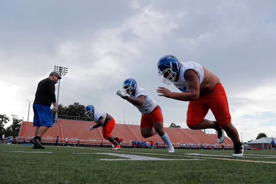 Offensive linemen run drills during practice at Savannah State University.