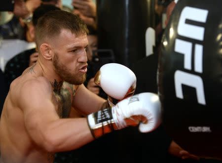 Aug 11, 2017; Las Vegas, NV, USA; Conor McGregor hits an uppercut bag during a media workout in preparation for his fight against Floyd Mayweather, Jr. at UFC Performance Institute. Mandatory Credit: Joe Camporeale-USA TODAY Sports