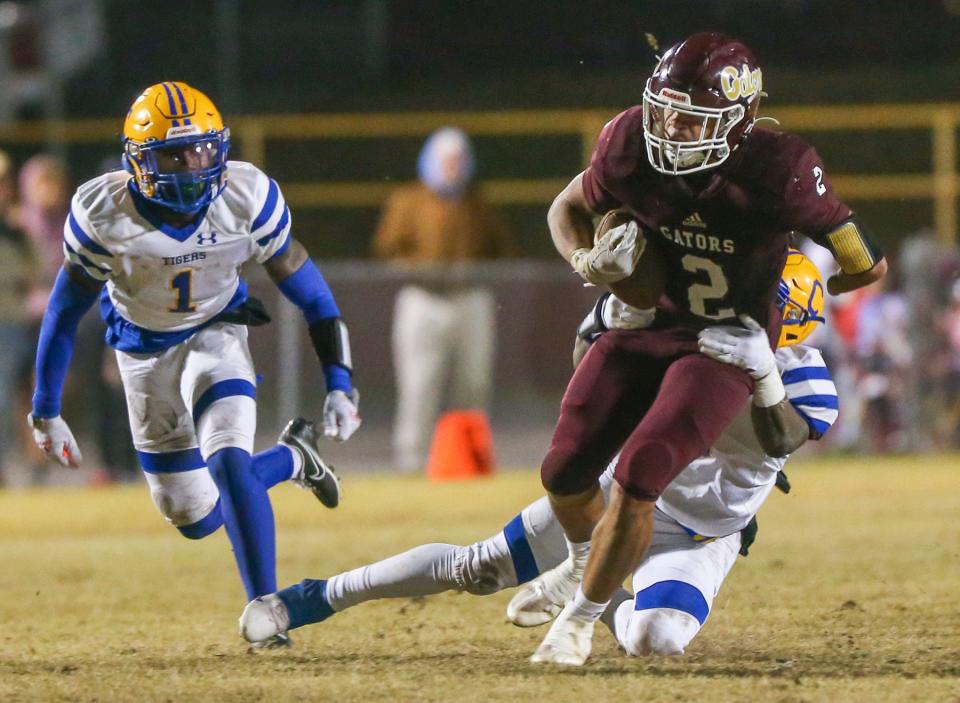 Kayleb Wagner fights for yards during the Baker Chipley Regional Final football game played at Baker. The Gators season ended with a 22-7 loss as the Tigers advance to the state Final Four.