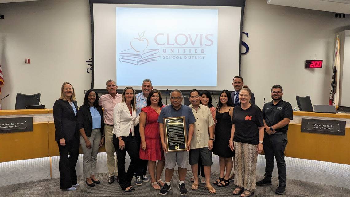 The Clovis Unified School District board granted the Hirayama family - including Kevin Hirayama (center with plaque) and Brian Hirayama (right, next to Kevin) - a proclamation plaque in honor of Satoshi “Fibber” Hirayama, a professional baseball player and beloved local educator, during a board meeting on July 12, 2023. Hirayama Elementary is the first school in Clovis named after a Japanese-American person and will open in August 2024.