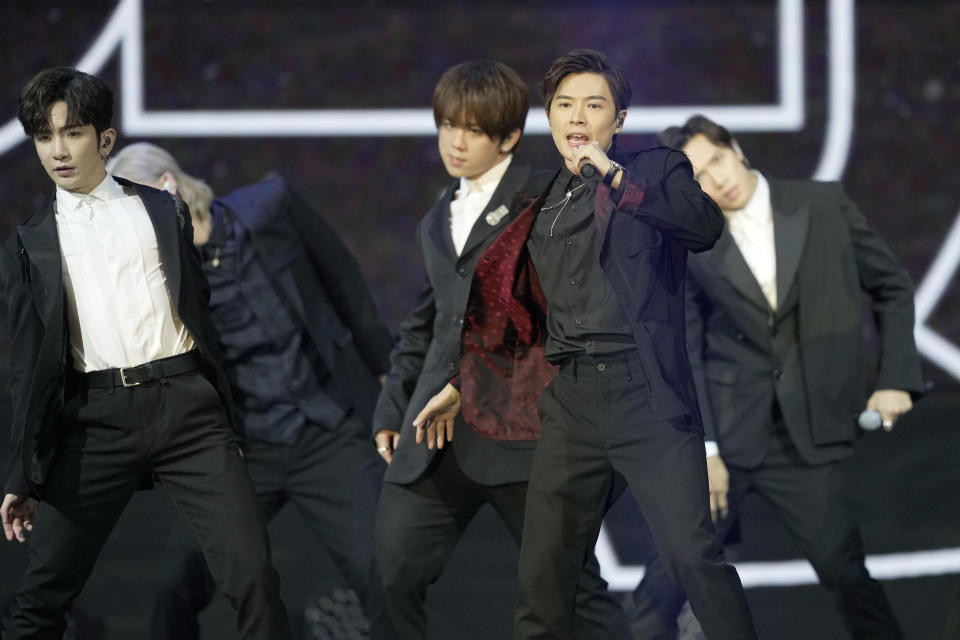 Members of Cantopop boyband "Mirror" perform at the Hong Kong Film Awards, Sunday, July 17, 2022. (AP Photo/Kin Cheung)