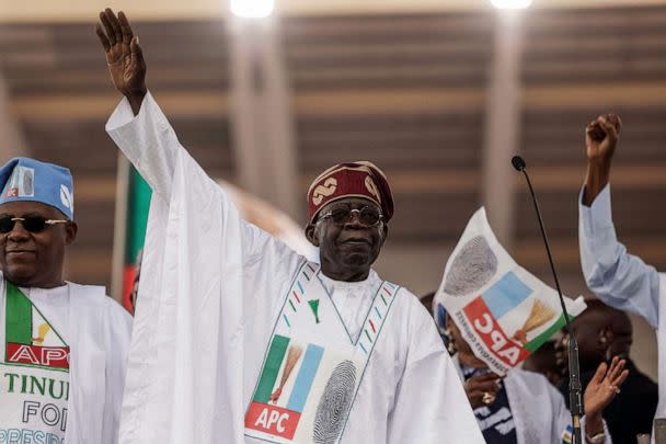 PHOTO: Bola Tinubu, presidential candidate of the All Progressives Congress (APC) party, gestures toward the crowd during a campaign rally at Teslim Balogun Stadium in Lagos, Nigeria, on Feb. 21, 2023. (Michele Spatari/AFP via Getty Images)