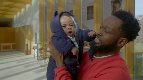 PHOTO: Bruce McIntyre is pictured holding his son Elias. (Onyx Collective / ABC News Studios)