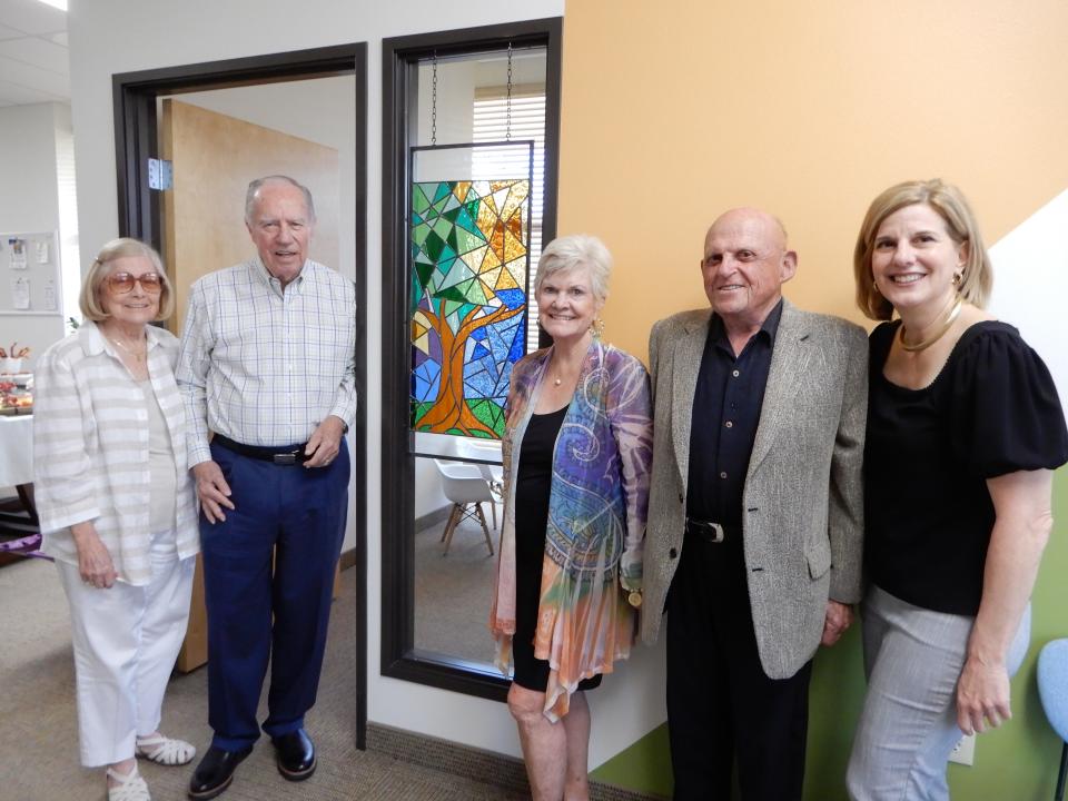 Lorraine Brinton, James Brinton, Connie Lurie, Bob Lurie and Tracy Fitzsimmons attend the dedication of an Olive Crest Counseling Center room dedicated in Devine’s memory.