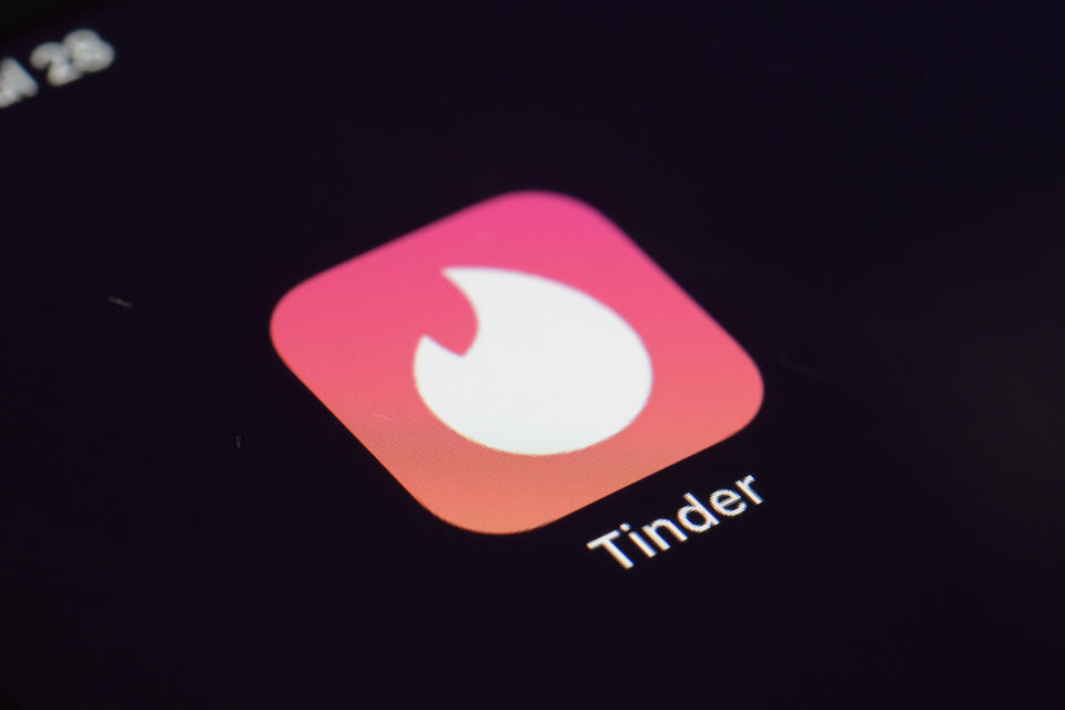 FILE - This July 28, 2020, file photo shows the icon for the Tinder dating app on a device in New York. According to a new study released Tuesday, Oct. 5, 2021, by Pew Research Center, the share of the U.S. population in their prime working years not living with a romantic partner has grown from 29% to 38% from 1990 to 2019. That's a concern for some researchers since the unpartnered population earns less, is less likely to be employed and has less education than those who are married or living with a partner. (AP Photo/Patrick Sison, File)