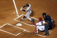 Baltimore Orioles' Kyle Stowers (83) hits an RBI-triple in front of Boston Red Sox's Reese McGuire (3) during the third inning of a baseball game, Monday, Sept. 26, 2022, in Boston. (AP Photo/Michael Dwyer)