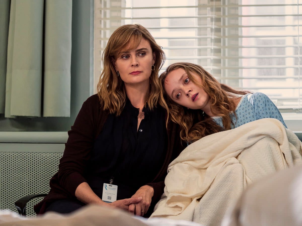 Dr Suzanne Mathis (Emily Deschanel) with cult escapee Mae (Madeleine Arthur) (Ricardo Hubbs/Netflix)